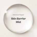 Intensive Repair Skin Barrier Mist in a clear round bottle displayed on a beige background.