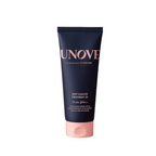 UNOVE Deep Damage Treatment tender bloom in a dark navy blue squeeze tube with a light pink cap, centered on a plain white background.