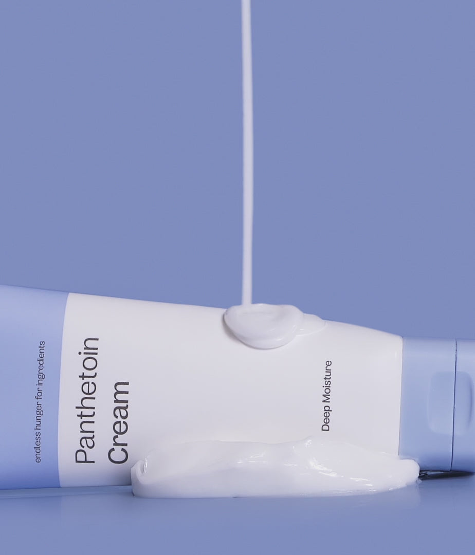 ma:nyo Panthetoin Cream 80ml tube with creamy texture on a blue background.