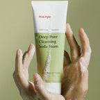 ma:nyo Purifying Cleansing Soda Foam 150ml in hands, showcasing fresh, deep-cleaning formula.